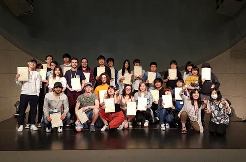 End of the workshop, group pictures, with a certificate in their hands.